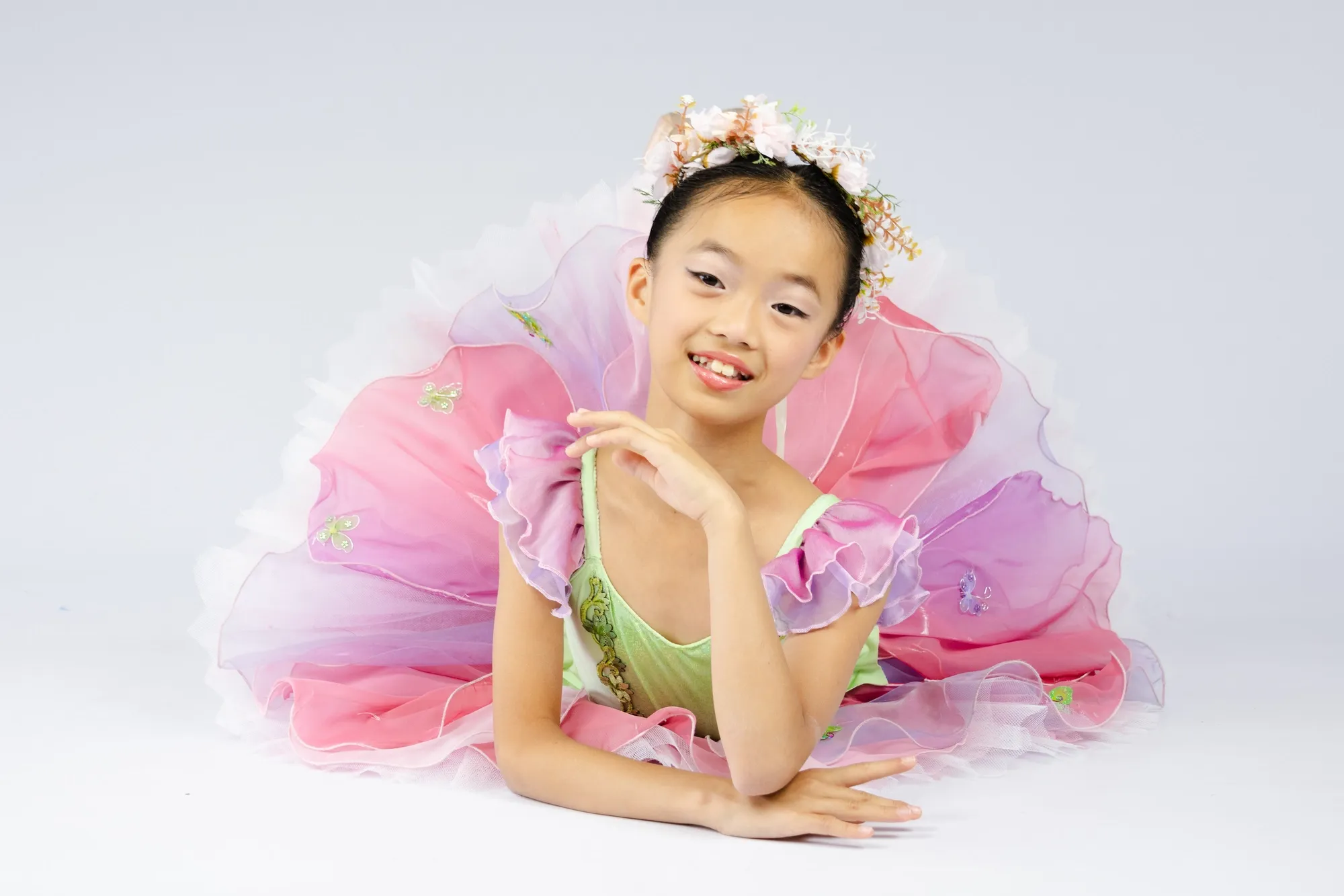 A headshot of a girl dressed as thumbelina.